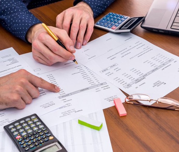 Patient in Matthews consulting with dentist about dental implant costs