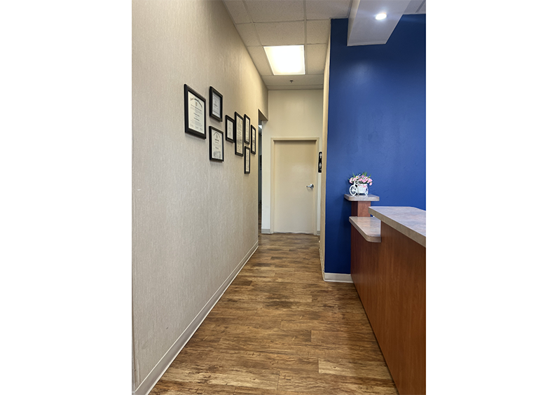 Hallway at dental practice with doors leading to treatment areas