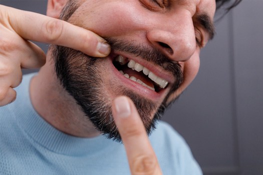 Patient smiling after tooth replacement