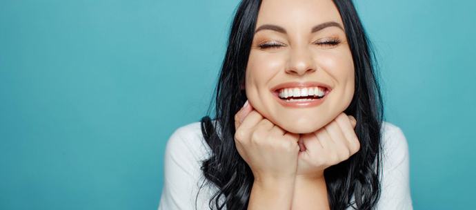 Lady smiles radiantly?